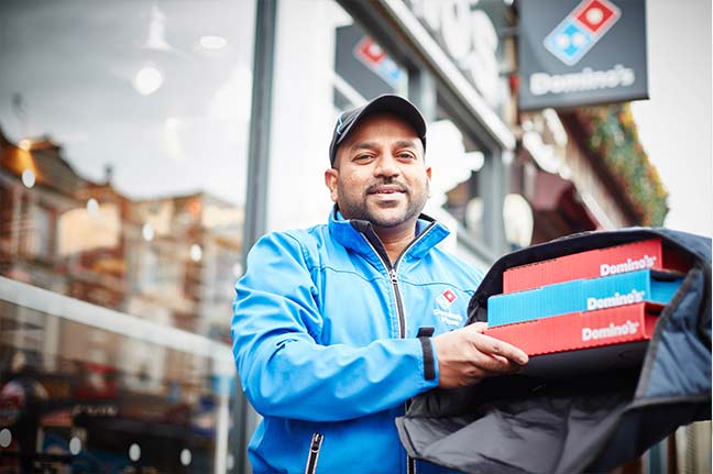 How does domino’s franchise model work?
